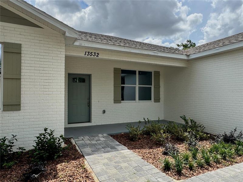 Front exterior of a new home in , Dade City, FL, highlighting curb appeal (Image 21).