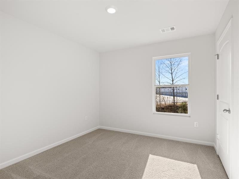 Spacious, unfurnished interior of a new home in Waypoint, Flowery Branch (Image 11).