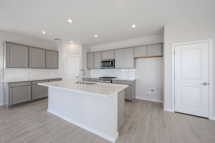 A kitchen with white cabinets. A kitchen with white cabinets.