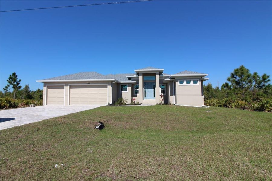 Front exterior of a new home in , Port Charlotte, FL, highlighting curb appeal (Image 12).