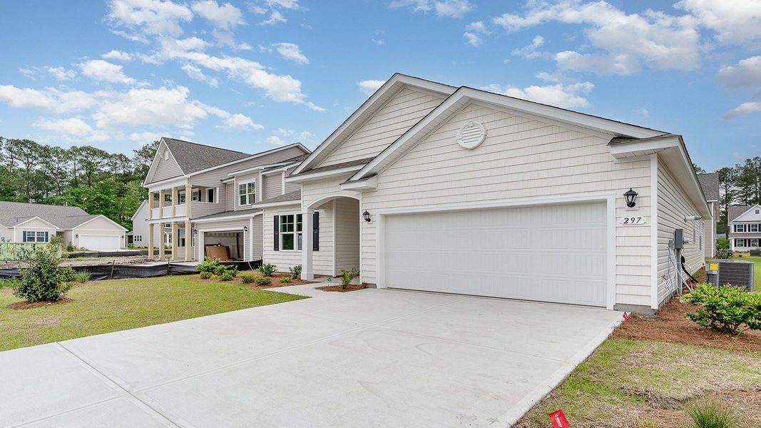 Representative exterior photo of a completed home built from the Eaton by D.R. Horton in Heron Pointe, Myrtle Beach, SC (Image 27).