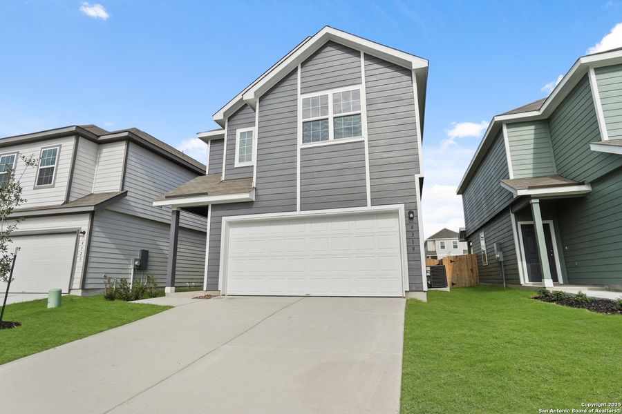 Front exterior of a new home in Melissa Ranch, San Antonio, TX, highlighting curb appeal (Image 16).