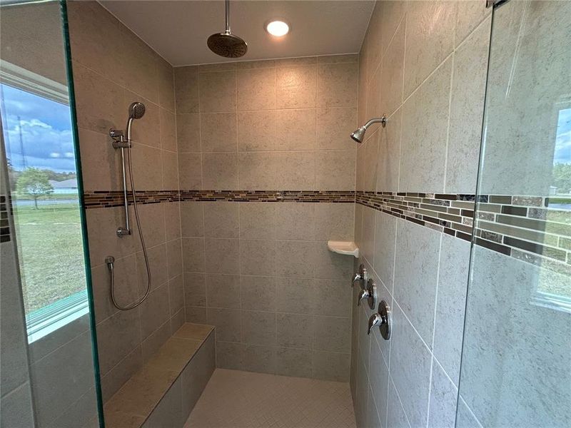 Primary bath with tile shower surround