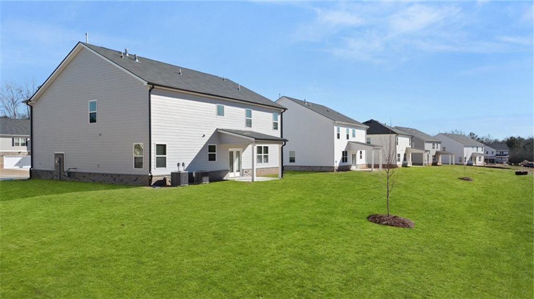 Exterior details and patio area of a home in Bridle Creek, Locust Grove (Image 17).