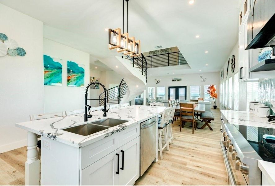 Easily serve meals to the adjacent dining table, or pull up a seat at the island seating 8