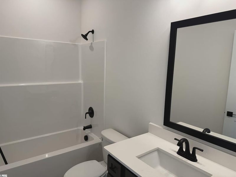 Furnished interior view inside a new home in Hidden Lake Estates, Greenville (Image 6).