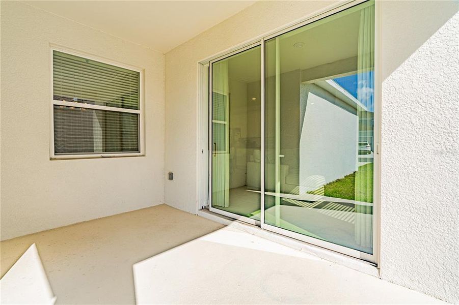 Exterior details and patio area of a home in Wellness Ridge, Clermont (Image 3).