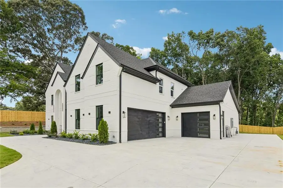 Front exterior of a new home in , Hoschton, GA, highlighting curb appeal (Image 28).