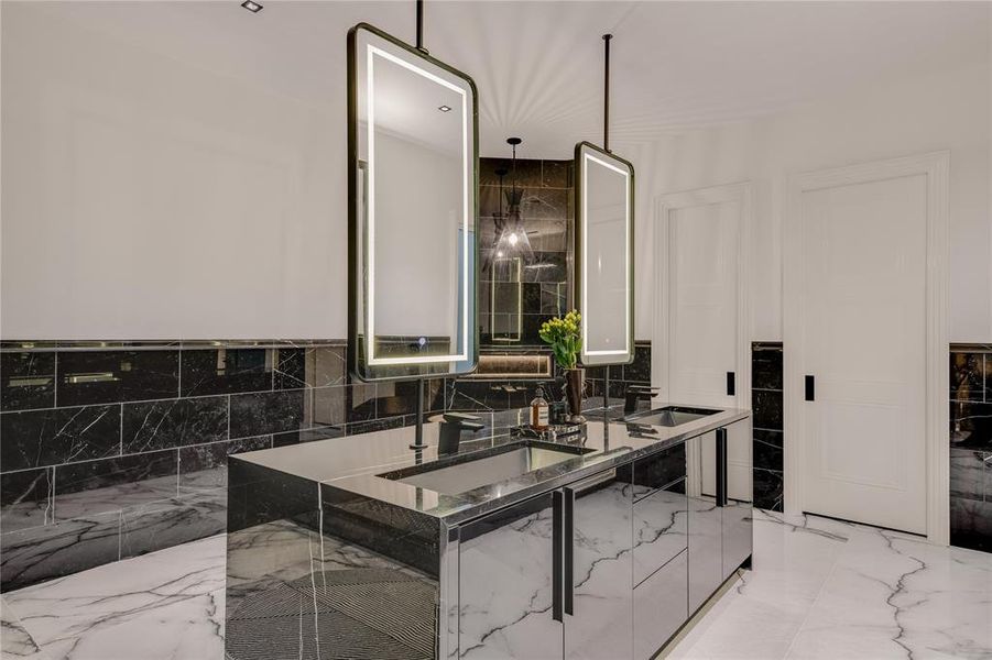 Primary bath with view of Vanity Island water closet and primary laundry room