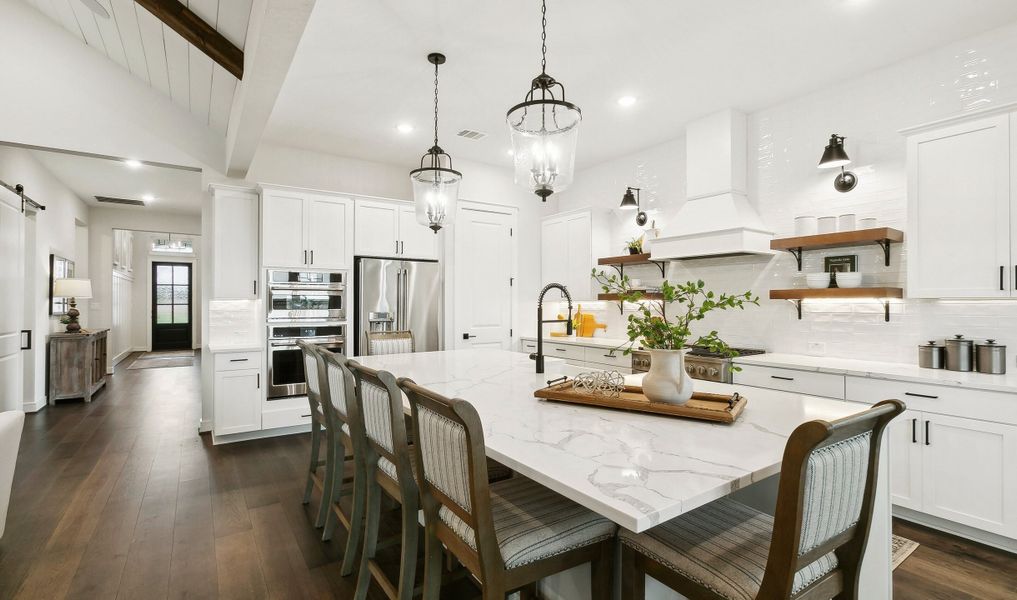 Kitchen with pendant lighting and floating shelves