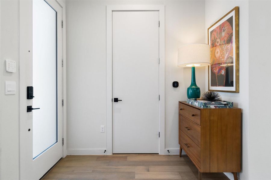 Foyer entrance featuring light wood-style floors