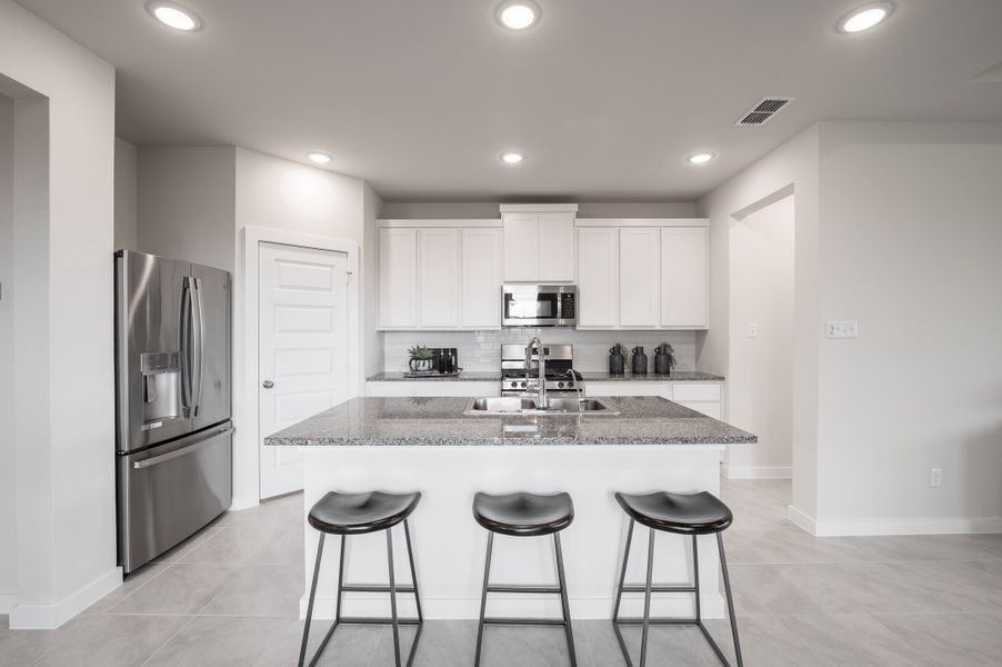 Representative furnished interior of a home built from the Caddo by Tri Pointe Homes in Mason Woods, Cypress (Image 44).
