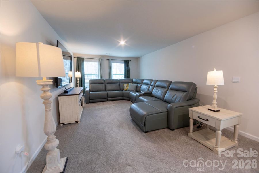 Upper-level loft, perfect for a family room or study area.