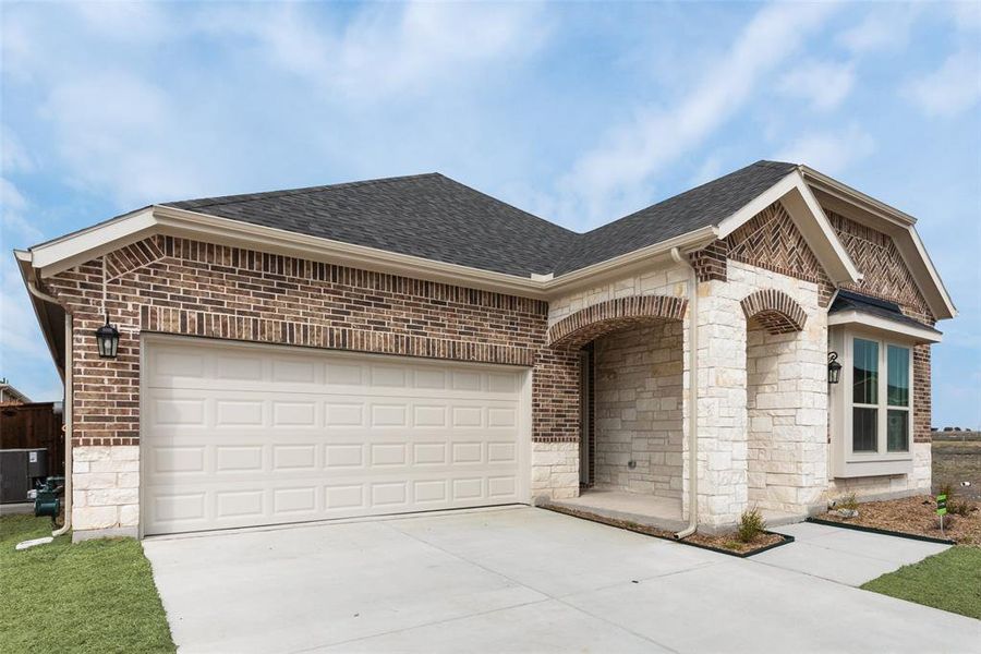 Front exterior of a new home in Walden Pond, Forney, TX, highlighting curb appeal (Image 18). Front exterior of a new home in Walden Pond, Forney, TX, highlighting curb appeal (Image 18).