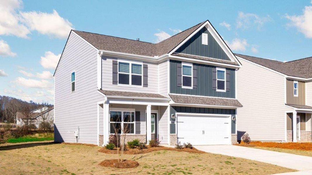 Front exterior of a new home in Prairie Pass, Apison, TN, highlighting curb appeal (Image 2). Front exterior of a new home in Prairie Pass, Apison, TN, highlighting curb appeal (Image 2).