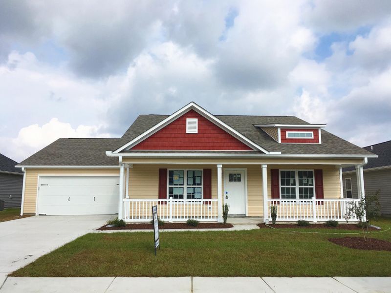 Representative exterior photo of a completed home built from the Kids 2 Car by JC Jackson Homes,LLC in Heritage Pointe, Newport, NC (Image 17).