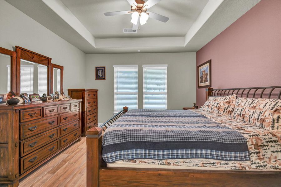 Another view of the oversized primary bedroom with tray ceilings Another view of the oversized primary bedroom with tray ceilings