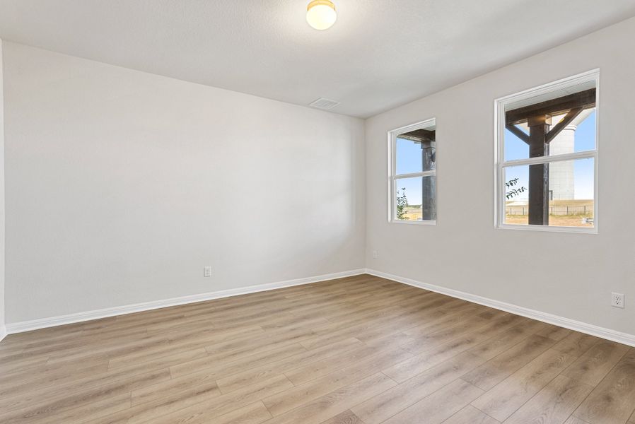 Representative unfurnished interior of a home built from the Somerville by Ashton Woods in Willow Springs, Buda (Image 16).