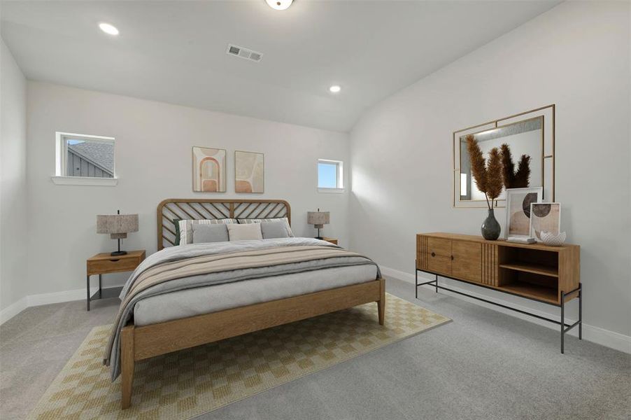 Bedroom featuring light colored carpet, lofted ceiling, and recessed lighting