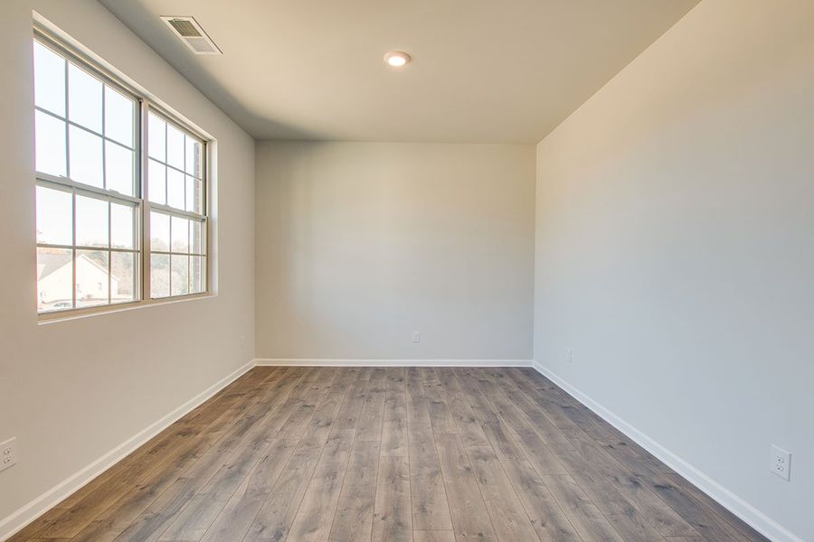 Representative unfurnished interior of a home built from the HAYDEN by D.R. Horton in The Parks, White House (Image 10).