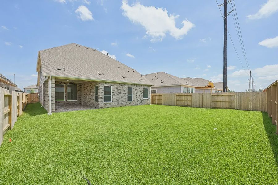 Exterior details and patio area of a home in Wood Leaf Reserve, Tomball (Image 24). Exterior details and patio area of a home in Wood Leaf Reserve, Tomball (Image 24).