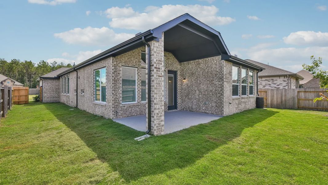 Exterior details and patio area of a home in Artavia, Conroe (Image 3).