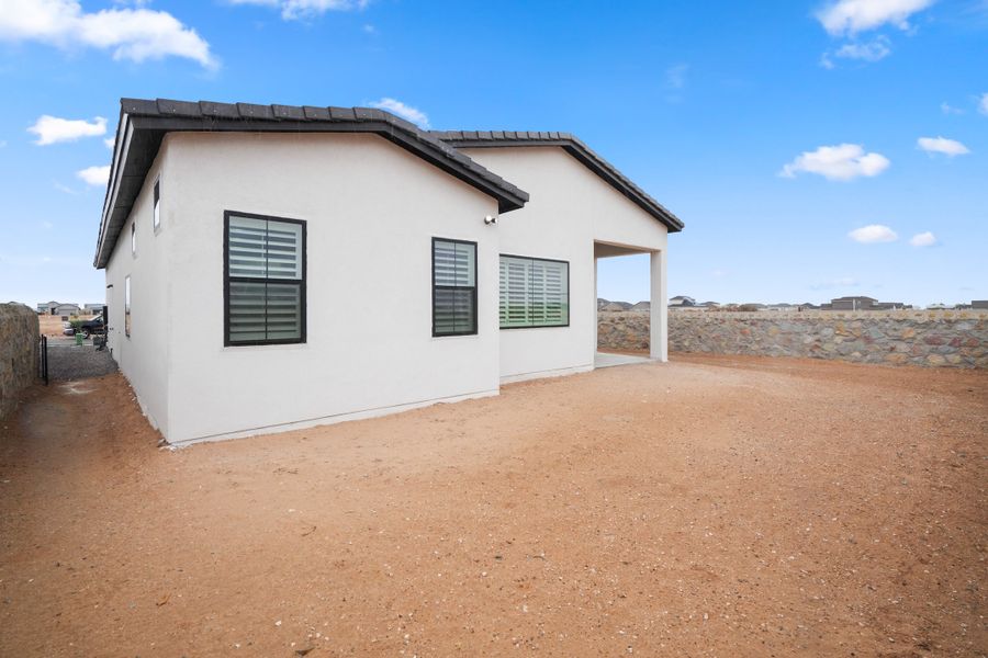 Front exterior of a new home in Painted Sky, El Paso, TX, highlighting curb appeal (Image 26).