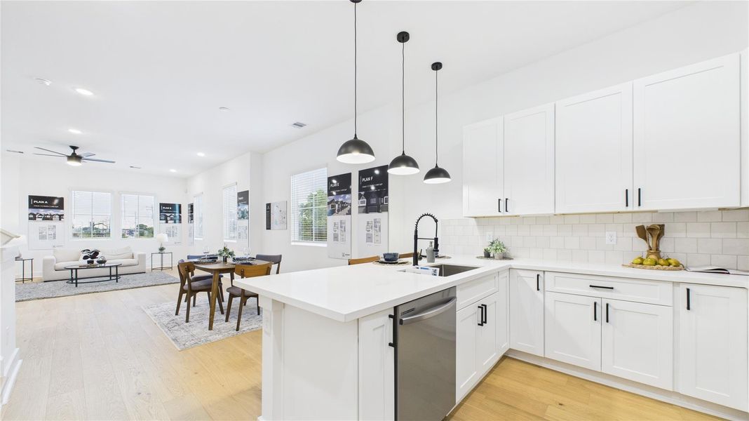 This beautifully designed open-concept kitchen is the perfect blend of style and functionality. Featuring a spacious kitchen peninsula, sleek stainless steel appliances, and ample countertop space, it offers a modern cooking and entertaining experience. The open layout seamlessly connects to the living and dining areas, creating a welcoming environment ideal for gatherings or everyday meals. Thoughtful design elements, quality finishes, and generous workspace make this kitchen a true standout in any home. This beautifully designed open-concept kitchen is the perfect blend of style and functionality. Featuring a spacious kitchen peninsula, sleek stainless steel appliances, and ample countertop space, it offers a modern cooking and entertaining experience. The open layout seamlessly connects to the living and dining areas, creating a welcoming environment ideal for gatherings or everyday meals. Thoughtful design elements, quality finishes, and generous workspace make this kitchen a true standout in any home.