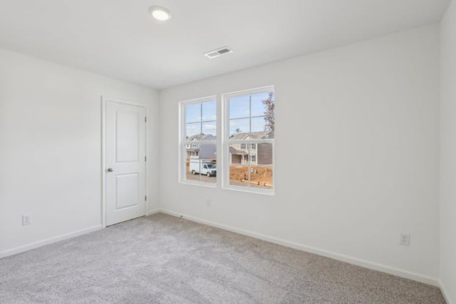 A room with a window and a door. A room with a window and a door.