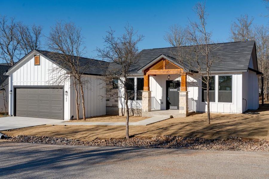 Front exterior of a new home in , Bastrop, TX, highlighting curb appeal (Image 21).