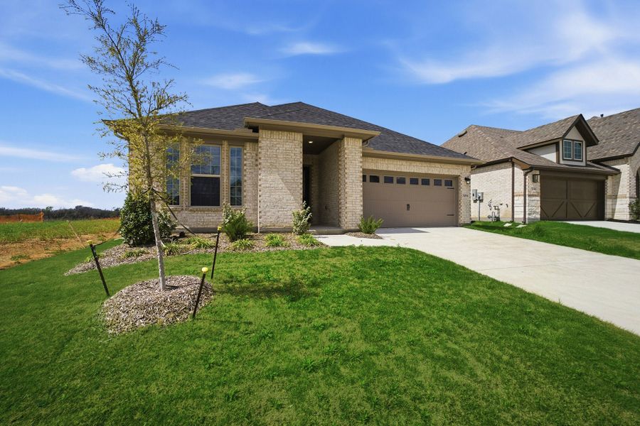 Front exterior of a new home in Westridge, McKinney, TX, highlighting curb appeal (Image 2). Front exterior of a new home in Westridge, McKinney, TX, highlighting curb appeal (Image 2).