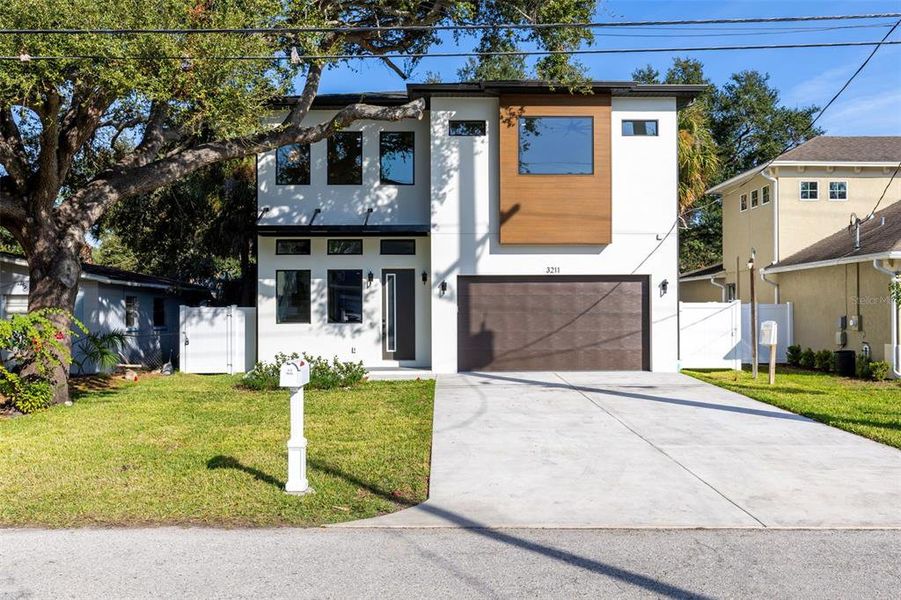 Front exterior of a new home in , Tampa, FL, highlighting curb appeal (Image 2).