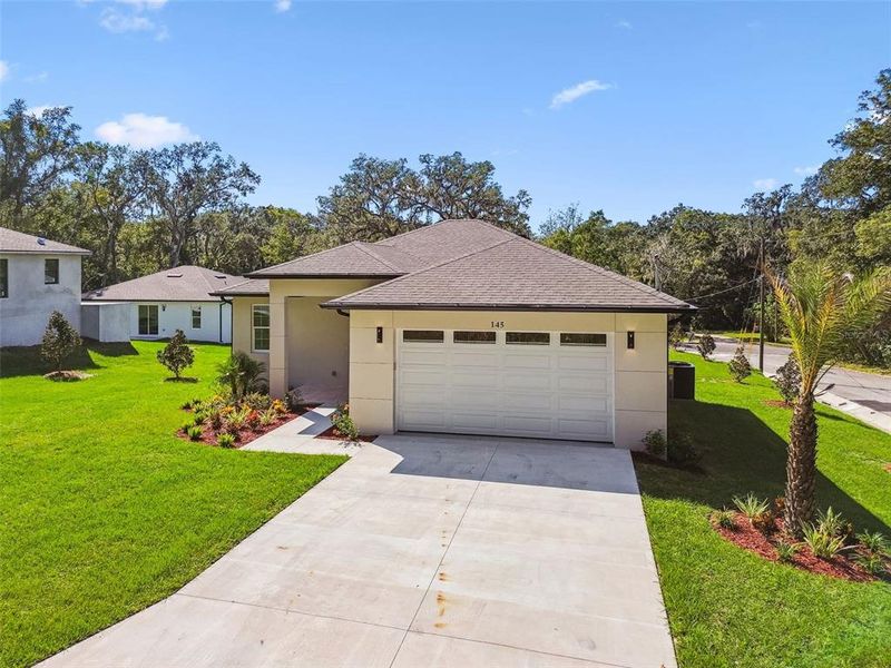 Front exterior of a new home in , Brooksville, FL, highlighting curb appeal (Image 1). Front exterior of a new home in , Brooksville, FL, highlighting curb appeal (Image 1).