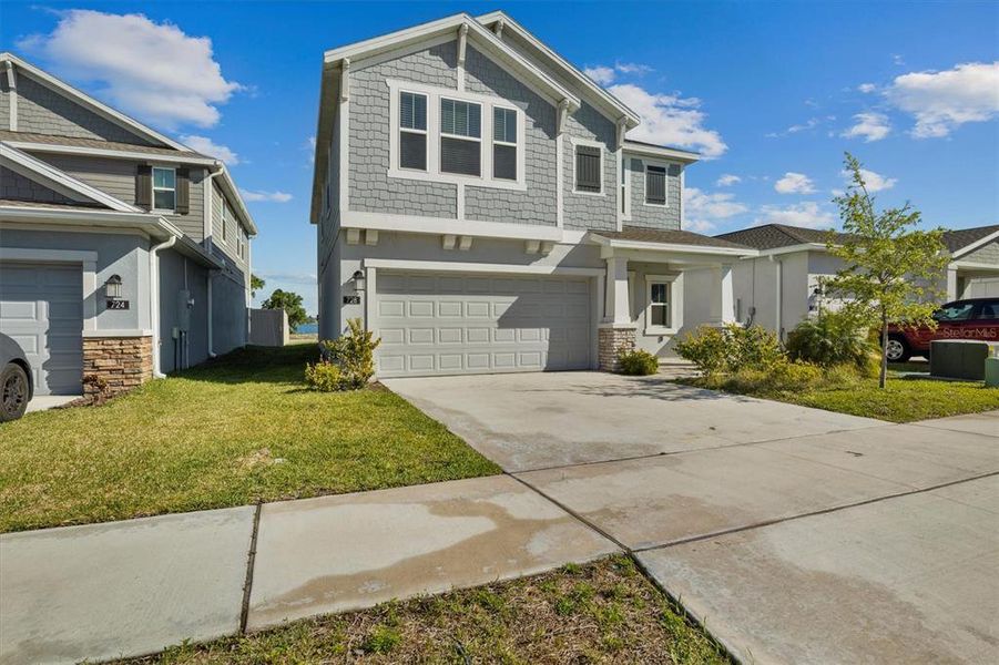 Front exterior of a new home in , Eagle Lake, FL, highlighting curb appeal (Image 2). Front exterior of a new home in , Eagle Lake, FL, highlighting curb appeal (Image 2).