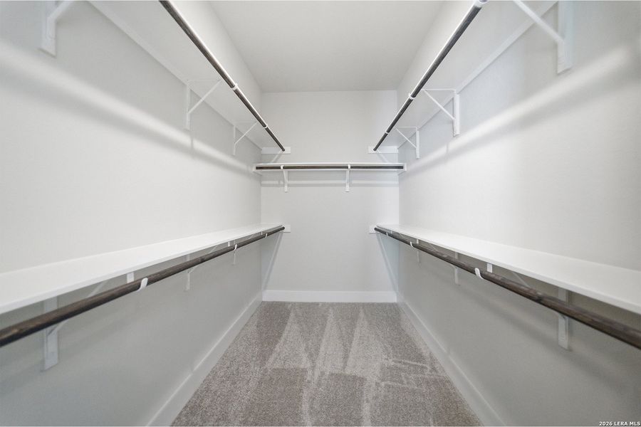 Spacious, unfurnished interior of a new home in The Woodlands at Medina Hills, Mico (Image 31).