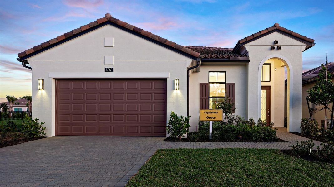 Front exterior of a new home in Cresswind Palm Beach at Westlake, Westlake, FL, highlighting curb appeal (Image 2).