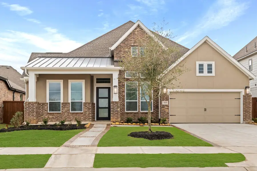Front exterior of a new home in Elyson, Katy, TX, highlighting curb appeal (Image 2). Front exterior of a new home in Elyson, Katy, TX, highlighting curb appeal (Image 2).
