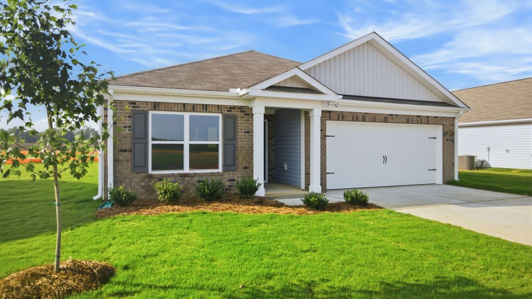 Front exterior of a new home in Bynum Farms, Farmville, NC, highlighting curb appeal (Image 2). Front exterior of a new home in Bynum Farms, Farmville, NC, highlighting curb appeal (Image 2).