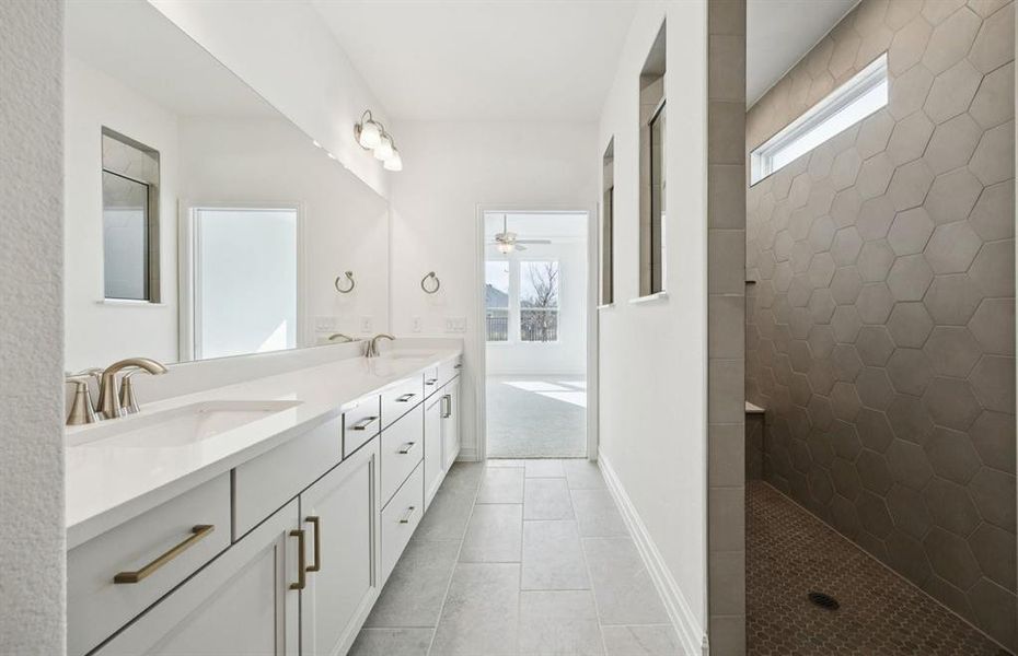 Owner's bath with spa shower