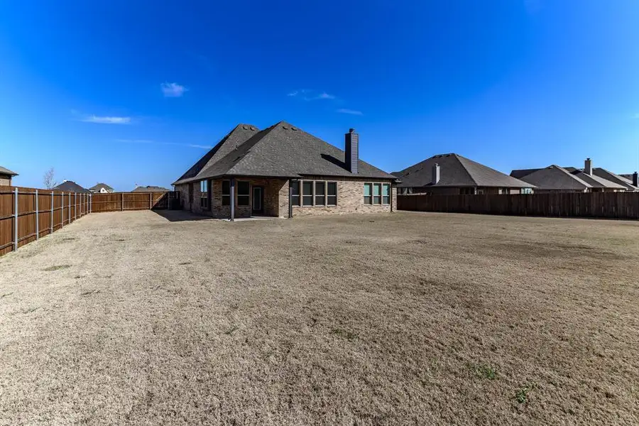 Exterior details and patio area of a home in Coyote Crossing, Godley (Image 3).