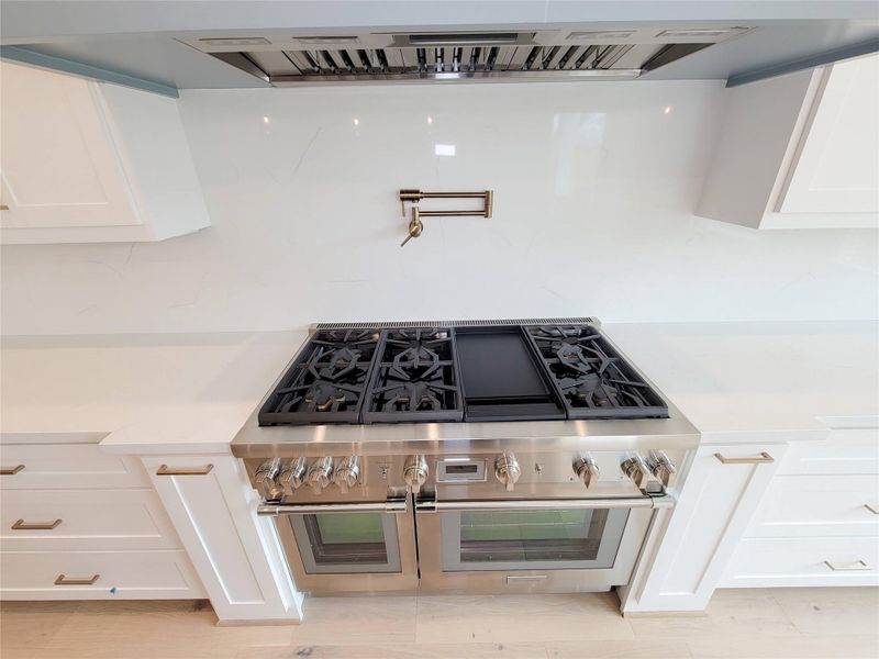 Thermador range and pot filler