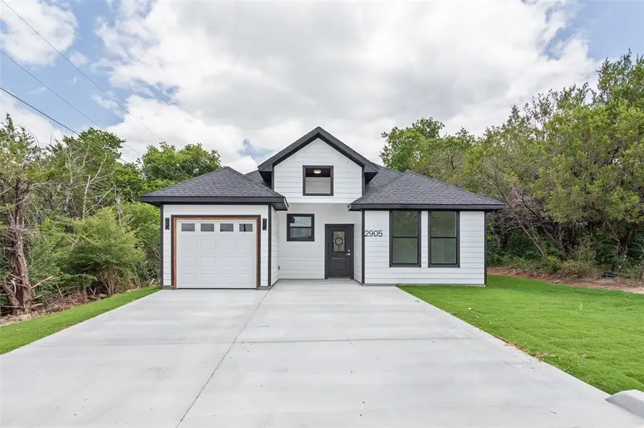 Front exterior of a new home in , Granbury, TX, highlighting curb appeal (Image 25).