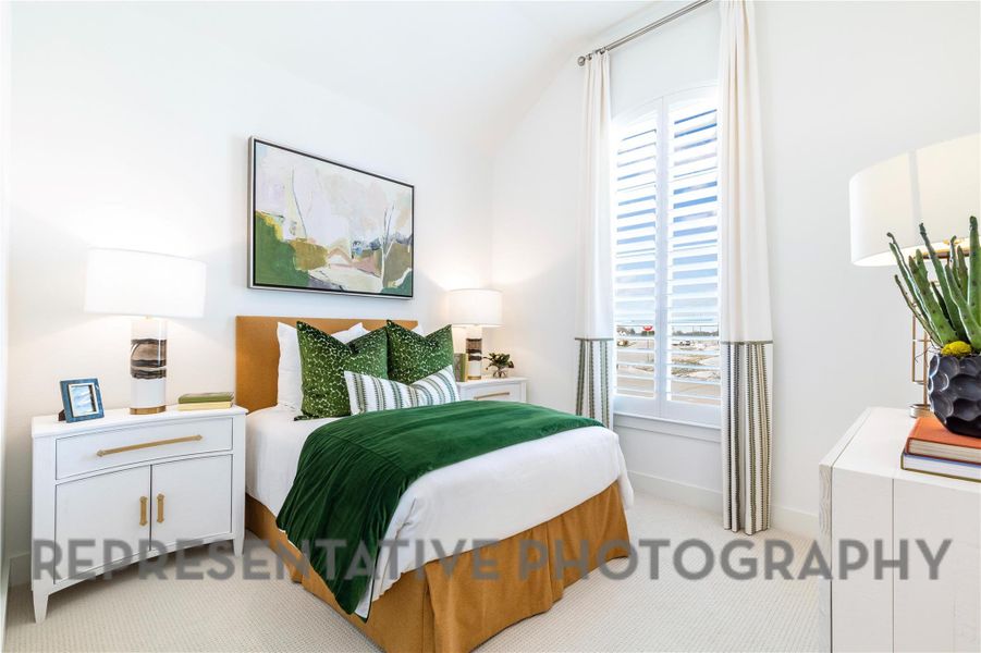 Bedroom with baseboards, light colored carpet, multiple windows, and vaulted ceiling Bedroom with baseboards, light colored carpet, multiple windows, and vaulted ceiling
