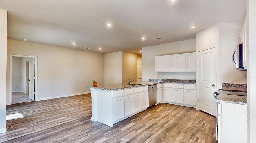 A kitchen with white cabinets. A kitchen with white cabinets.