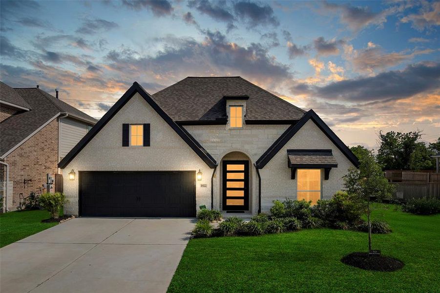 Front exterior of a new home in Amira, Tomball, TX, highlighting curb appeal (Image 2).