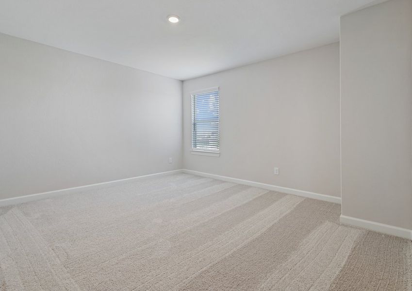 Secondary bedroom with carpet