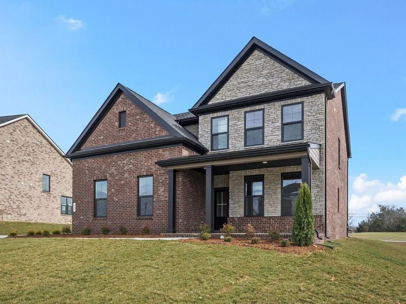 Front exterior of a new home in Benders Cove, Mount Juliet, TN, highlighting curb appeal (Image 2). Front exterior of a new home in Benders Cove, Mount Juliet, TN, highlighting curb appeal (Image 2).