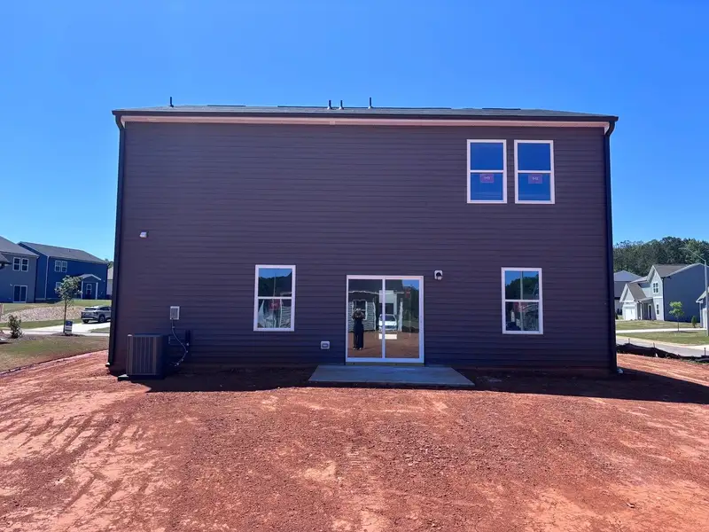 Exterior details and patio area of a home in Middleton Farms, Middlesex (Image 3).