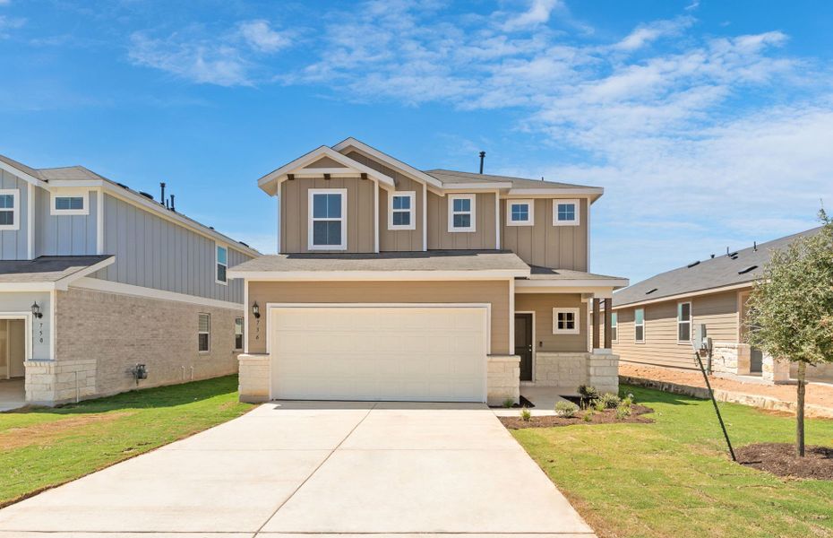 Front exterior of a new home in Sunfield, Buda, TX, highlighting curb appeal (Image 2). Front exterior of a new home in Sunfield, Buda, TX, highlighting curb appeal (Image 2).