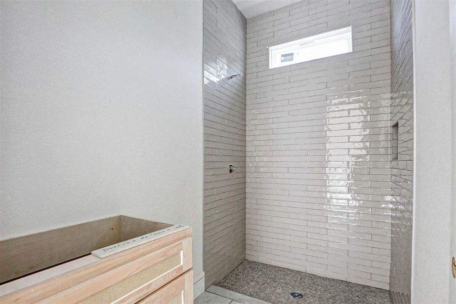 Bathroom with a tile shower